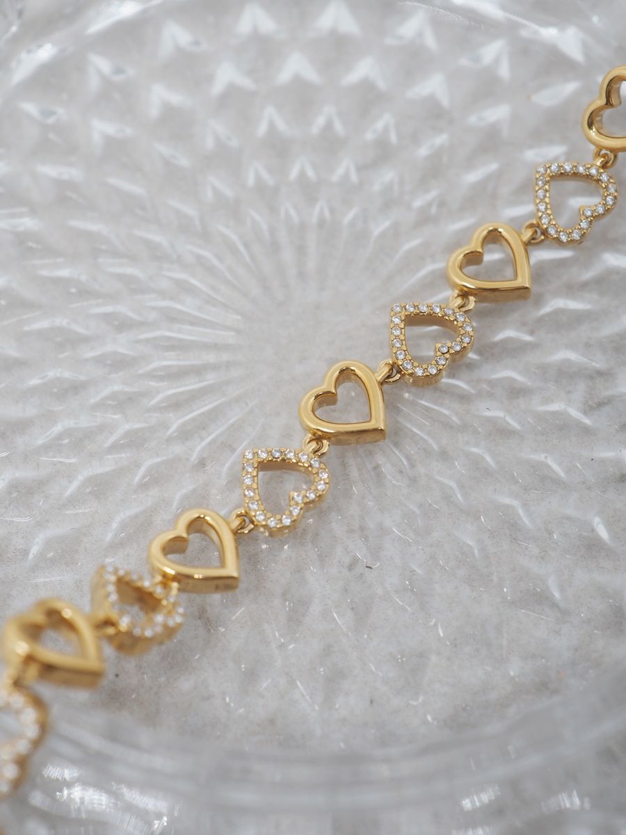 Hjertearmbånd i stål gullfarget