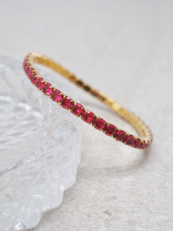 Tennisarmbånd strikk fuksia