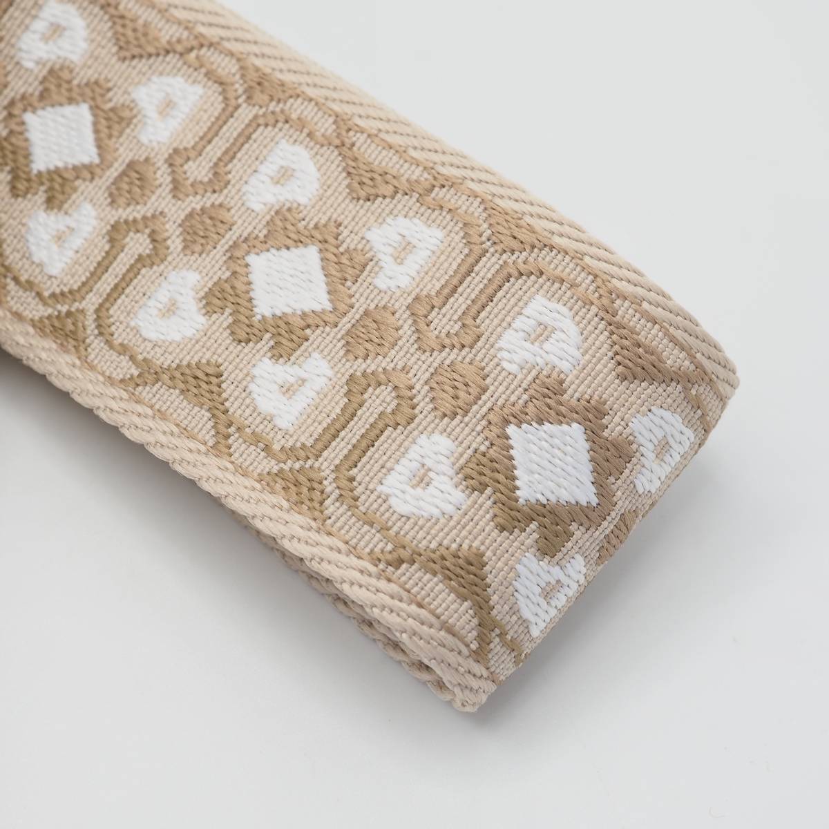 Veskestropp med geometrisk broderi beige/hvit