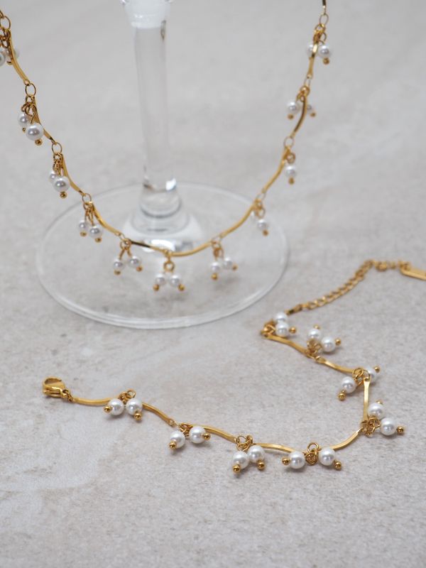 Armbånd med perlecharms